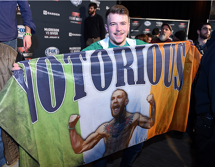 BOSTON, MA - JANUARY 16: A fan poses with his Conor McGregor Irish flag at Faneuil Hall on January 16, 2015 in Boston, Massachusetts. (Photo by Jeff Bottari/Zuffa LLC/Zuffa LLC via Getty Images)