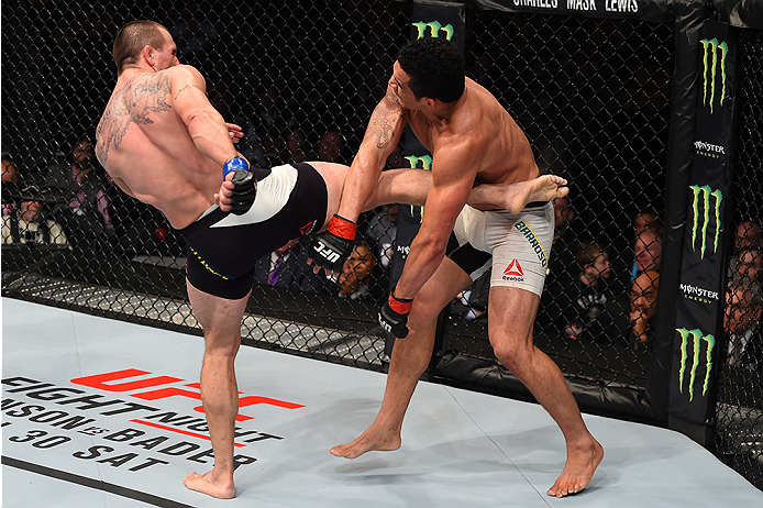 BOSTON, MA - JANUARY 17: (L-R) Elvis Mutapcic of Bosnia kicks Francimar Barroso of Brazil in their light heavyweight bout during the UFC Fight Night event inside TD Garden on January 17, 2016 in Boston, Massachusetts. (Photo by Jeff Bottari/Zuffa LLC/Zuf