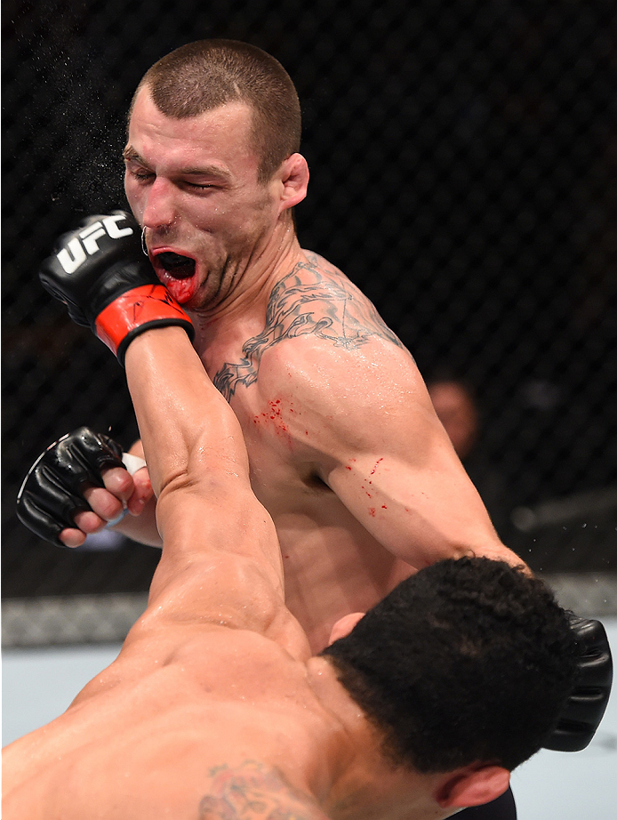 BOSTON, MA - JANUARY 17: (R-L) Francimar Barroso of Brazil punches Elvis Mutapcic of Bosnia in their light heavyweight bout during the UFC Fight Night event inside TD Garden on January 17, 2016 in Boston, Massachusetts. (Photo by Jeff Bottari/Zuffa LLC/Z