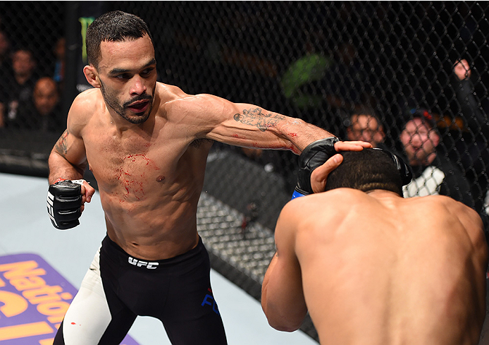 BOSTON, MA - JANUARY 17: (L-R) Rob Font punches Joey Gomez in their bantamweight bout during the UFC Fight Night event inside TD Garden on January 17, 2016 in Boston, Massachusetts. (Photo by Jeff Bottari/Zuffa LLC/Zuffa LLC via Getty Images)