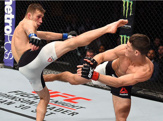 BOSTON, MA - JANUARY 17: (L-R) Kyle Bochniak and Charles Rosa trade kicks in their featherweight bout during the UFC Fight Night event inside TD Garden on January 17, 2016 in Boston, Massachusetts. (Photo by Jeff Bottari/Zuffa LLC/Zuffa LLC via Getty Ima