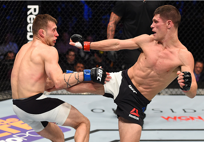 BOSTON, MA - JANUARY 17: (R-L) Charles Rosa kicks Kyle Bochniak in their featherweight bout during the UFC Fight Night event inside TD Garden on January 17, 2016 in Boston, Massachusetts. (Photo by Jeff Bottari/Zuffa LLC/Zuffa LLC via Getty Images)