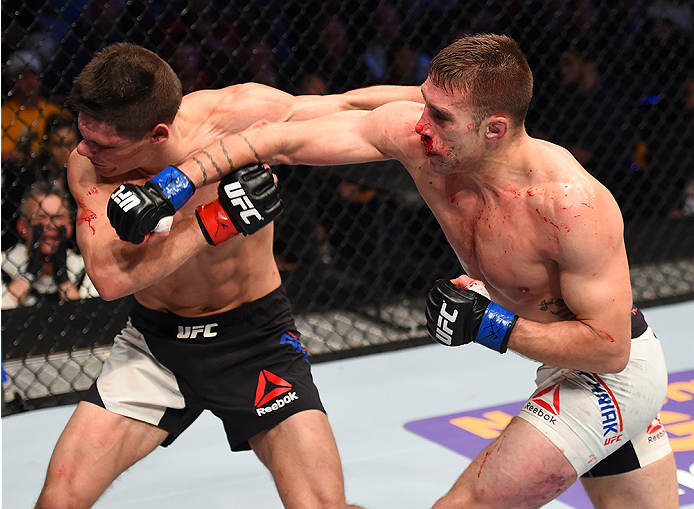BOSTON, MA - JANUARY 17: (R-L) Kyle Bochniak punches Charles Rosa in their featherweight bout during the UFC Fight Night event inside TD Garden on January 17, 2016 in Boston, Massachusetts. (Photo by Jeff Bottari/Zuffa LLC/Zuffa LLC via Getty Images)
