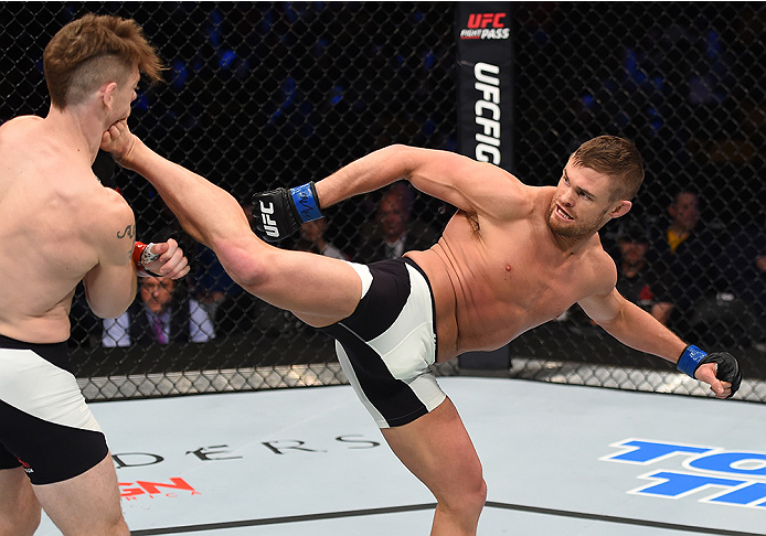 BOSTON, MA - JANUARY 17: (R-L) Daron Cruickshank kicks Paul Felder in their lightweight bout during the UFC Fight Night event inside TD Garden on January 17, 2016 in Boston, Massachusetts. (Photo by Jeff Bottari/Zuffa LLC/Zuffa LLC via Getty Images)