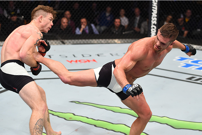 BOSTON, MA - JANUARY 17: (R-L) Daron Cruickshank kicks Paul Felder in their lightweight bout during the UFC Fight Night event inside TD Garden on January 17, 2016 in Boston, Massachusetts. (Photo by Jeff Bottari/Zuffa LLC/Zuffa LLC via Getty Images)