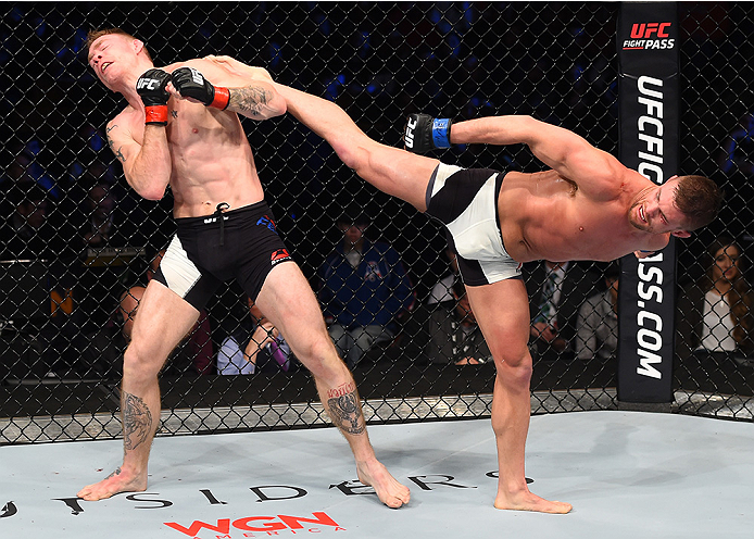 BOSTON, MA - JANUARY 17: (R-L) Daron Cruickshank kicks Paul Felder in their lightweight bout during the UFC Fight Night event inside TD Garden on January 17, 2016 in Boston, Massachusetts. (Photo by Jeff Bottari/Zuffa LLC/Zuffa LLC via Getty Images)