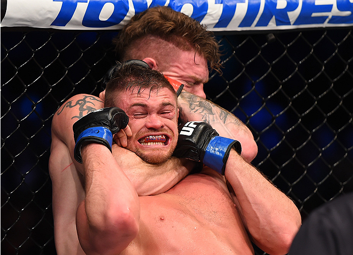 BOSTON, MA - JANUARY 17: (R-L) Paul Felder secures a rear choke submission against Daron Cruickshank in their lightweight bout during the UFC Fight Night event inside TD Garden on January 17, 2016 in Boston, Massachusetts. (Photo by Jeff Bottari/Zuffa LL