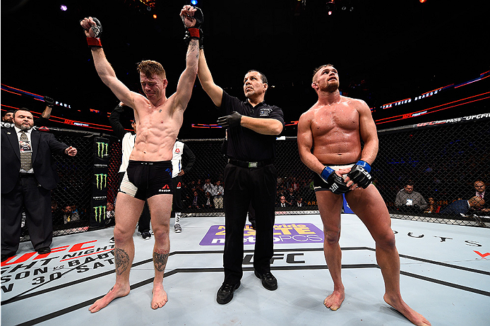 BOSTON, MA - JANUARY 17: Paul Felder (L) celebrates after his submission victory over Daron Cruickshank in their lightweight bout during the UFC Fight Night event inside TD Garden on January 17, 2016 in Boston, Massachusetts. (Photo by Jeff Bottari/Zuffa