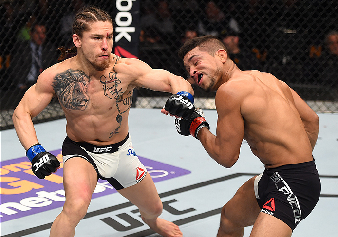 BOSTON, MA - JANUARY 17: (L-R) Luke Sanders punches Maximo Blanco in their featherweight bout during the UFC Fight Night event inside TD Garden on January 17, 2016 in Boston, Massachusetts. (Photo by Jeff Bottari/Zuffa LLC/Zuffa LLC via Getty Images)
