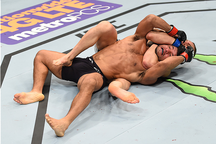 BOSTON, MA - JANUARY 17: (L-R) Luke Sanders secures a rear choke submission against Maximo Blanco in their featherweight bout during the UFC Fight Night event inside TD Garden on January 17, 2016 in Boston, Massachusetts. (Photo by Jeff Bottari/Zuffa LLC