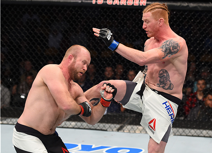 BOSTON, MA - JANUARY 17: (R-L) Ed Herman kicks Tim Boetsch in their light heavyweight bout during the UFC Fight Night event inside TD Garden on January 17, 2016 in Boston, Massachusetts. (Photo by Jeff Bottari/Zuffa LLC/Zuffa LLC via Getty Images)