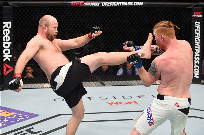 BOSTON, MA - JANUARY 17: (L-R) Tim Boetsch kicks Ed Herman in their light heavyweight bout during the UFC Fight Night event inside TD Garden on January 17, 2016 in Boston, Massachusetts. (Photo by Jeff Bottari/Zuffa LLC/Zuffa LLC via Getty Images)