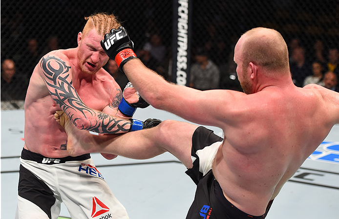 BOSTON, MA - JANUARY 17: (R-L) Tim Boetsch kicks Ed Herman in their light heavyweight bout during the UFC Fight Night event inside TD Garden on January 17, 2016 in Boston, Massachusetts. (Photo by Jeff Bottari/Zuffa LLC/Zuffa LLC via Getty Images)