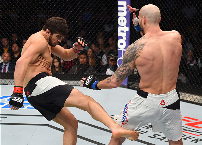 BOSTON, MA - JANUARY 17: (L-R) Patrick Cote of Canada kicks Ben Saunders in their welterweight bout during the UFC Fight Night event inside TD Garden on January 17, 2016 in Boston, Massachusetts. (Photo by Jeff Bottari/Zuffa LLC/Zuffa LLC via Getty Image