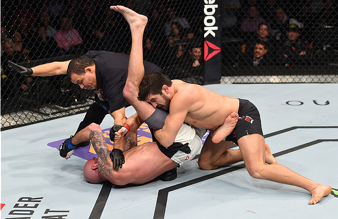 BOSTON, MA - JANUARY 17: The referee stops the bout as Patrick Cote (R) of Canada defeats Ben Saunders (L) in their welterweight bout during the UFC Fight Night event inside TD Garden on January 17, 2016 in Boston, Massachusetts. (Photo by Jeff Bottari/Z