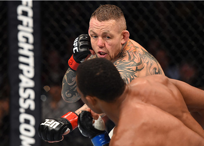 BOSTON, MA - JANUARY 17: (R-L) Ross Pearson of England punches Francisco Trinaldo of Brazil in their lightweight bout during the UFC Fight Night event inside TD Garden on January 17, 2016 in Boston, Massachusetts. (Photo by Jeff Bottari/Zuffa LLC/Zuffa L