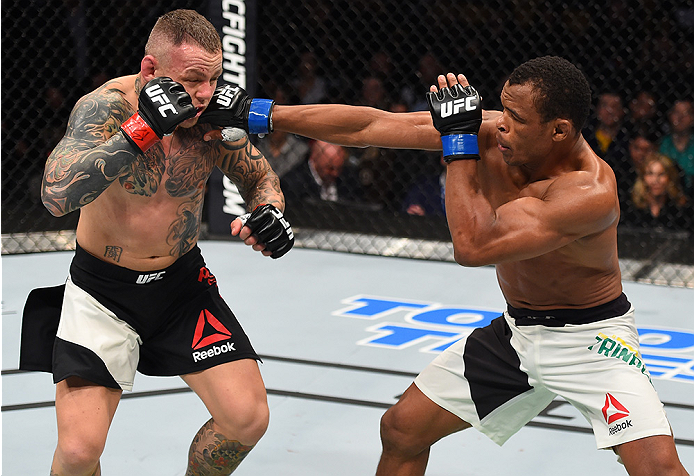BOSTON, MA - JANUARY 17: (R-L) Francisco Trinaldo of Brazil punches Ross Pearson of England in their lightweight bout during the UFC Fight Night event inside TD Garden on January 17, 2016 in Boston, Massachusetts. (Photo by Jeff Bottari/Zuffa LLC/Zuffa L