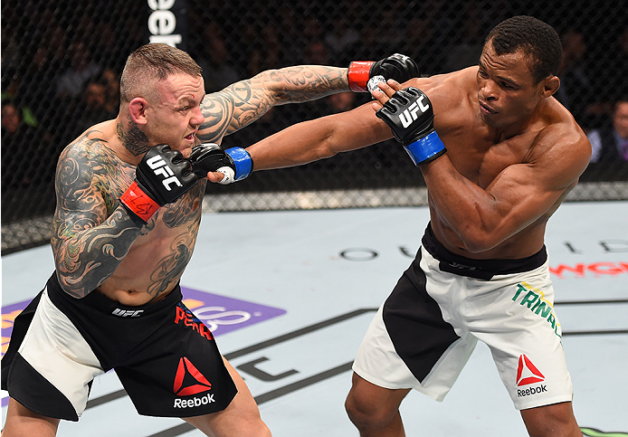 BOSTON, MA - JANUARY 17: (L-R) Ross Pearson of England punches Francisco Trinaldo of Brazil in their lightweight bout during the UFC Fight Night event inside TD Garden on January 17, 2016 in Boston, Massachusetts. (Photo by Jeff Bottari/Zuffa LLC/Zuffa L