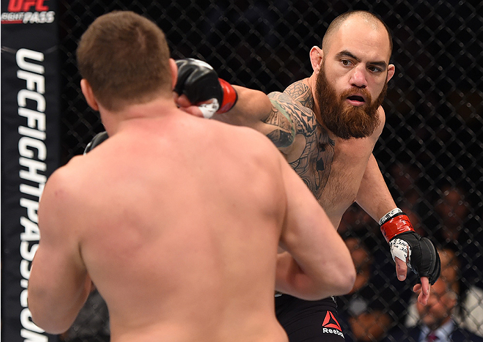 BOSTON, MA - JANUARY 17: (R-L) Travis Browne punches Matt Mitrione in their heavyweight bout during the UFC Fight Night event inside TD Garden on January 17, 2016 in Boston, Massachusetts. (Photo by Jeff Bottari/Zuffa LLC/Zuffa LLC via Getty Images)