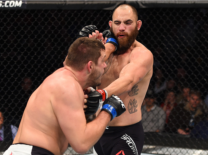 BOSTON, MA - JANUARY 17: (L-R) Matt Mitrione punches Travis Browne in their heavyweight bout during the UFC Fight Night event inside TD Garden on January 17, 2016 in Boston, Massachusetts. (Photo by Jeff Bottari/Zuffa LLC/Zuffa LLC via Getty Images)