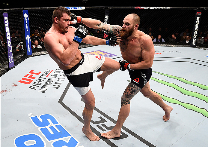 BOSTON, MA - JANUARY 17: (R-L) Travis Browne punches Matt Mitrione in their heavyweight bout during the UFC Fight Night event inside TD Garden on January 17, 2016 in Boston, Massachusetts. (Photo by Jeff Bottari/Zuffa LLC/Zuffa LLC via Getty Images)