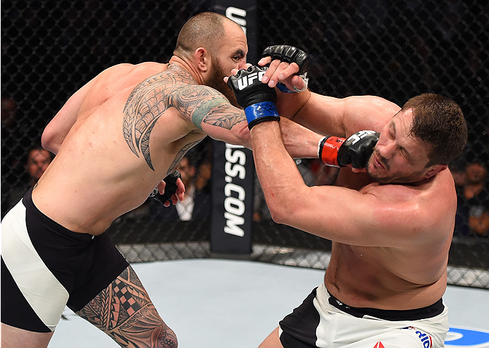 BOSTON, MA - JANUARY 17: (L-R) Travis Browne punches Matt Mitrione in their heavyweight bout during the UFC Fight Night event inside TD Garden on January 17, 2016 in Boston, Massachusetts. (Photo by Jeff Bottari/Zuffa LLC/Zuffa LLC via Getty Images)