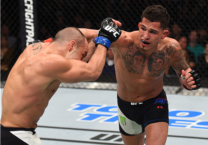 BOSTON, MA - JANUARY 17: (R-L) Anthony Pettis punches Eddie Alvarez in their lightweight bout during the UFC Fight Night event inside TD Garden on January 17, 2016 in Boston, Massachusetts. (Photo by Jeff Bottari/Zuffa LLC/Zuffa LLC via Getty Images)