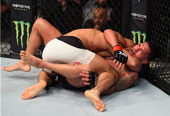 BOSTON, MA - JANUARY 17: (R-L) Anthony Pettis struggles to defend against Eddie Alvarez on the mat in their lightweight bout during the UFC Fight Night event inside TD Garden on January 17, 2016 in Boston, Massachusetts. (Photo by Jeff Bottari/Zuffa LLC/