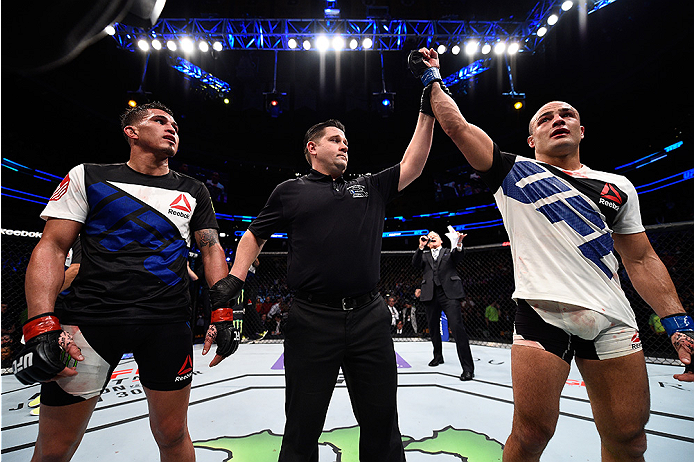 BOSTON, MA - JANUARY 17: Eddie Alvarez (R) celebrates after his split-decision victory over Anthony Pettis in their lightweight bout during the UFC Fight Night event inside TD Garden on January 17, 2016 in Boston, Massachusetts. (Photo by Jeff Bottari/Zu