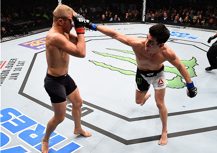 BOSTON, MA - JANUARY 17: (R-L) Dominick Cruz punches TJ Dillashaw in their UFC bantamweight championship bout during the UFC Fight Night event inside TD Garden on January 17, 2016 in Boston, Massachusetts. (Photo by Jeff Bottari/Zuffa LLC/Zuffa LLC via G