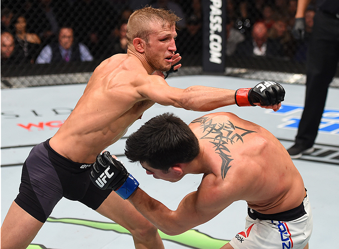 BOSTON, MA - JANUARY 17: (R-L) Dominick Cruz slips a punch by TJ Dillashaw in their UFC bantamweight championship bout during the UFC Fight Night event inside TD Garden on January 17, 2016 in Boston, Massachusetts. (Photo by Jeff Bottari/Zuffa LLC/Zuffa