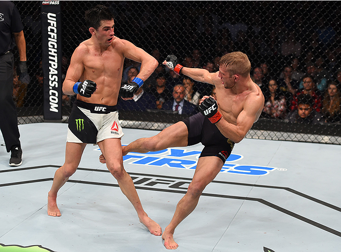 BOSTON, MA - JANUARY 17: (R-L) TJ Dillashaw kicks the leg of Dominick Cruz in their UFC bantamweight championship bout during the UFC Fight Night event inside TD Garden on January 17, 2016 in Boston, Massachusetts. (Photo by Jeff Bottari/Zuffa LLC/Zuffa