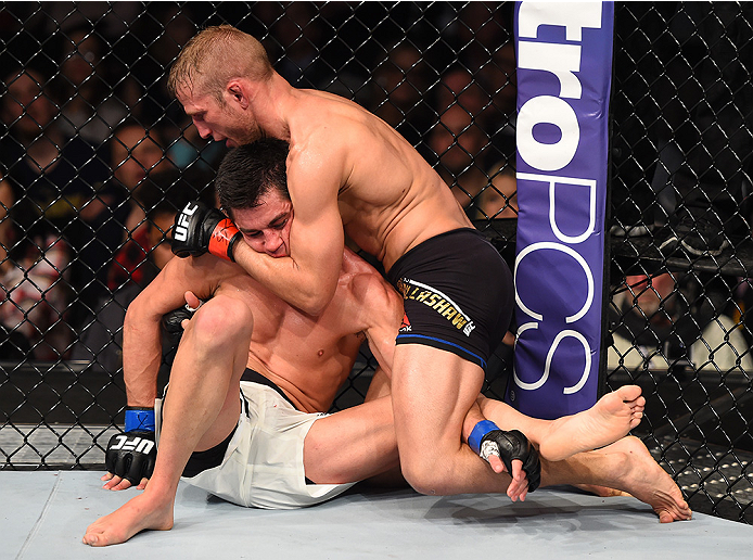 BOSTON, MA - JANUARY 17: (R-L) TJ Dillashaw grapples with Dominick Cruz in their UFC bantamweight championship bout during the UFC Fight Night event inside TD Garden on January 17, 2016 in Boston, Massachusetts. (Photo by Jeff Bottari/Zuffa LLC/Zuffa LLC