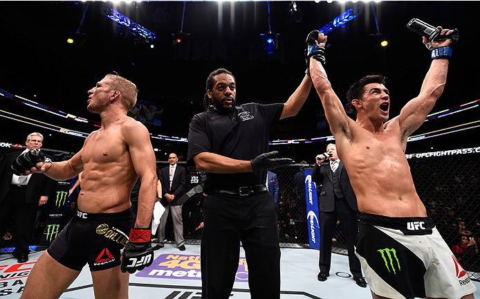 BOSTON, MA - JANUARY 17: Dominick Cruz (R) celebrates his split-decision victory over TJ Dillashaw (L) in their UFC bantamweight championship bout during the UFC Fight Night event inside TD Garden on January 17, 2016 in Boston, Massachusetts. (Photo by J