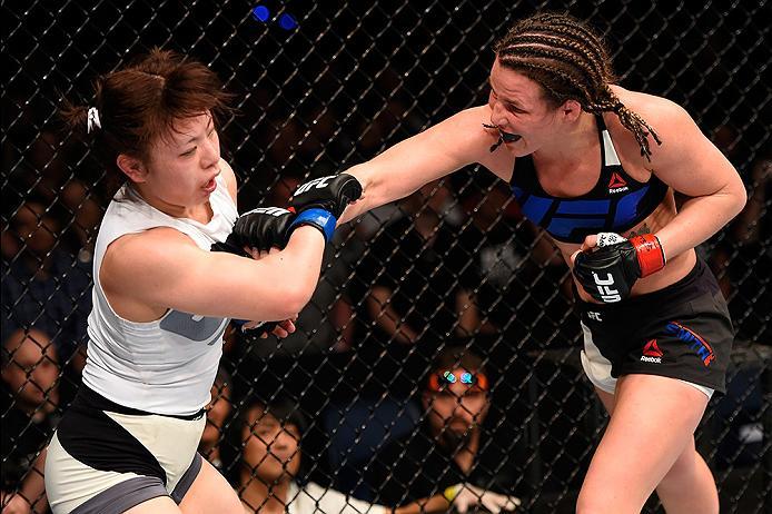BRISBANE, AUSTRALIA - MARCH 20: (R-L) Leslie Smith of the United States punches Rin Nakai of Japan in their women's bantamweight bout during the UFC Fight Night event at the Brisbane Entertainment Centre on March 20, 2016 in Brisbane, Australia. (Photo b