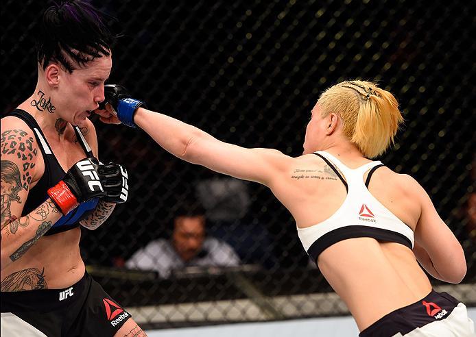 BRISBANE, AUSTRALIA - MARCH 20: (R-L) Seohee Ham of South Korea punches Bec Rawlings of Australia in their women's strawweight bout during the UFC Fight Night event at the Brisbane Entertainment Centre on March 20, 2016 in Brisbane, Australia. (Photo by