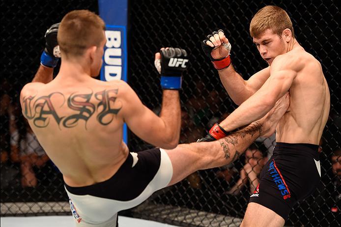 BRISBANE, AUSTRALIA - MARCH 20: (L-R) Johnny Case kicks Jake Matthews of Australia in their lightweight bout during the UFC Fight Night event at the Brisbane Entertainment Centre on March 20, 2016 in Brisbane, Australia. (Photo by Josh Hedges/Zuffa LLC/Z