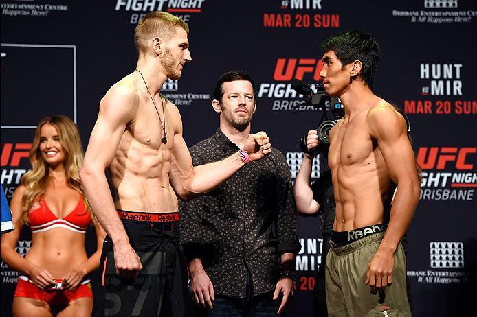 BRISBANE, AUSTRALIA - MARCH 19: (L-R) Opponents Dan Hooker of New Zealand and Mark Eddiva of the Philippines face off during the UFC Fight Night weigh-in at the Brisbane Entertainment Centre on March 19, 2016 in Brisbane, Australia. (Photo by Josh Hedges