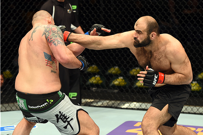 FAIRFAX, VA - APRIL 04: (R-L) Shamil Abdurakhimov of Russia punches Timothy Johnson in their heavyweight fight during the UFC Fight Night event at the Patriot Center on April 4, 2015 in Fairfax, Virginia. (Photo by Josh Hedges/Zuffa LLC/Zuffa LLC via Ge