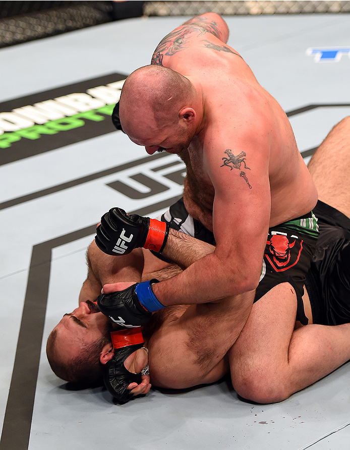 FAIRFAX, VA - APRIL 04: (R-L) Timothy Johnson punches Shamil Abdurakhimov of Russia in their heavyweight fight during the UFC Fight Night event at the Patriot Center on April 4, 2015 in Fairfax, Virginia. (Photo by Josh Hedges/Zuffa LLC/Zuffa LLC via Ge