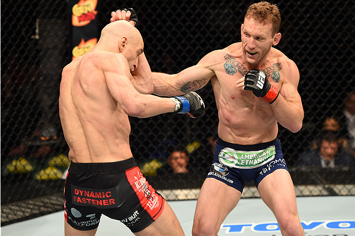 FAIRFAX, VA - APRIL 04: (R-L) Gray Maynard punches Alexander Yakovlev in their lightweight fight during the UFC Fight Night event at the Patriot Center on April 4, 2015 in Fairfax, Virginia. (Photo by Josh Hedges/Zuffa LLC/Zuffa LLC via Getty Images)