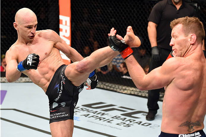 FAIRFAX, VA - APRIL 04: (L-R) Alexander Yakovlev kicks Gray Maynard in their lightweight fight during the UFC Fight Night event at the Patriot Center on April 4, 2015 in Fairfax, Virginia. (Photo by Josh Hedges/Zuffa LLC/Zuffa LLC via Getty Images)