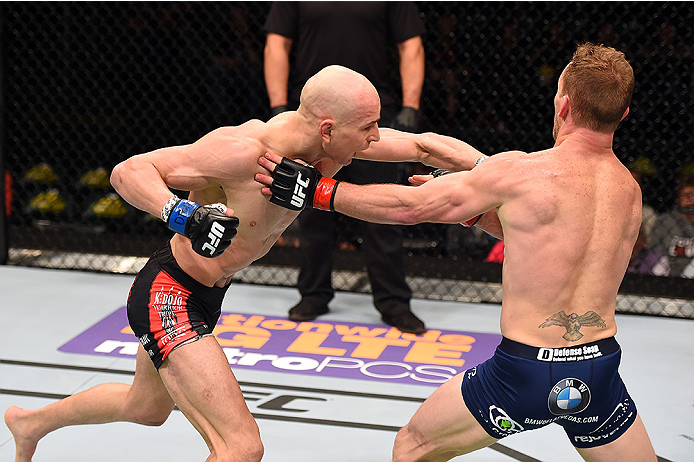 FAIRFAX, VA - APRIL 04: (L-R) Alexander Yakovlev punches Gray Maynard in their lightweight fight during the UFC Fight Night event at the Patriot Center on April 4, 2015 in Fairfax, Virginia. (Photo by Josh Hedges/Zuffa LLC/Zuffa LLC via Getty Images)