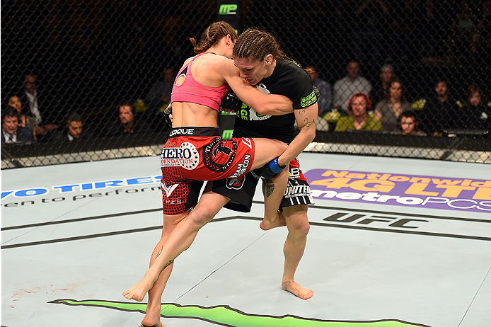 FAIRFAX, VA - APRIL 04: (R-L) Lauren Murphy attempts a takedown against Liz Carmouche in their women's bantamweight fight during the UFC Fight Night event at the Patriot Center on April 4, 2015 in Fairfax, Virginia. (Photo by Josh Hedges/Zuffa LLC/Zuffa