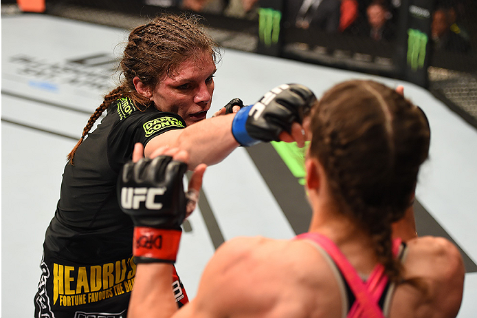 FAIRFAX, VA - APRIL 04: (L-R) Lauren Murphy punches Liz Carmouche in their women's bantamweight fight during the UFC Fight Night event at the Patriot Center on April 4, 2015 in Fairfax, Virginia. (Photo by Josh Hedges/Zuffa LLC/Zuffa LLC via Getty Image