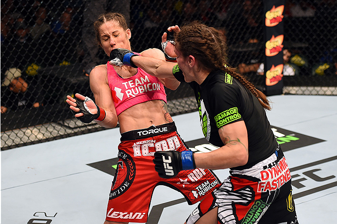 FAIRFAX, VA - APRIL 04: (R-L) Lauren Murphy punches Liz Carmouche in their women's bantamweight fight during the UFC Fight Night event at the Patriot Center on April 4, 2015 in Fairfax, Virginia. (Photo by Josh Hedges/Zuffa LLC/Zuffa LLC via Getty Image