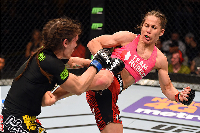 FAIRFAX, VA - APRIL 04: (R-L) Liz Carmouche kicks Lauren Murphy in their women's bantamweight fight during the UFC Fight Night event at the Patriot Center on April 4, 2015 in Fairfax, Virginia. (Photo by Josh Hedges/Zuffa LLC/Zuffa LLC via Getty Images)