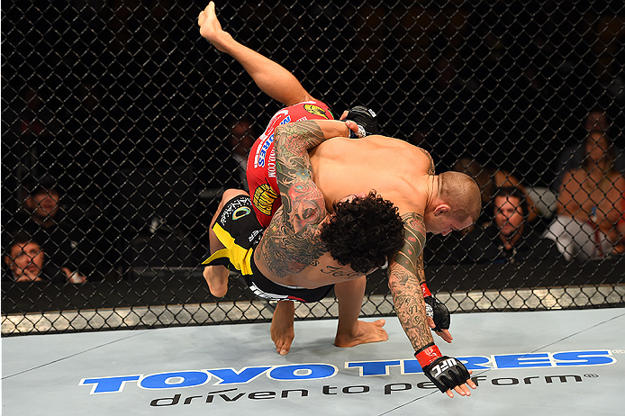 FAIRFAX, VA - APRIL 04: (L-R) Diego Ferreira takes down Dustin Poirier in their lightweight fight during the UFC Fight Night event at the Patriot Center on April 4, 2015 in Fairfax, Virginia. (Photo by Josh Hedges/Zuffa LLC/Zuffa LLC via Getty Images)