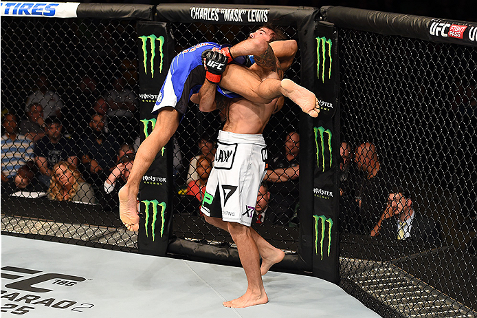 FAIRFAX, VA - APRIL 04: (R-L) Clay Guida attempts to take down Robbie Peralta in their featherweight fight during the UFC Fight Night event at the Patriot Center on April 4, 2015 in Fairfax, Virginia. (Photo by Josh Hedges/Zuffa LLC/Zuffa LLC via Getty I