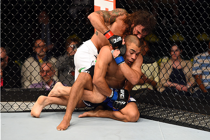 FAIRFAX, VA - APRIL 04: (L-R) Clay Guida punches Robbie Peralta in their featherweight fight during the UFC Fight Night event at the Patriot Center on April 4, 2015 in Fairfax, Virginia. (Photo by Josh Hedges/Zuffa LLC/Zuffa LLC via Getty Images)